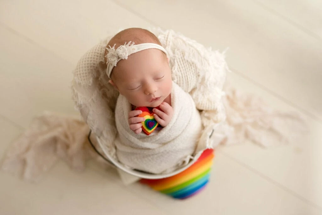 webbabyshower baby sleeping in a chair with fabric 