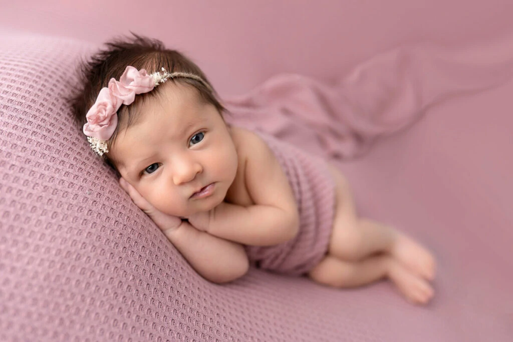 webbabyshower baby in pink awake for newborn photoshoot