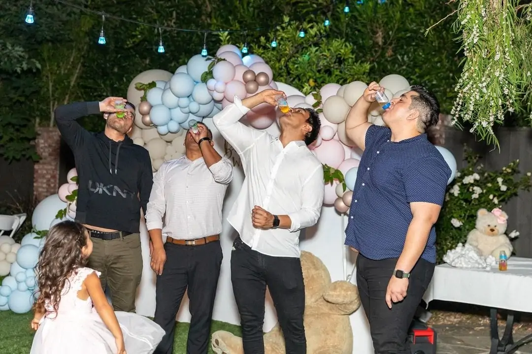 baby bottle chugging contest at a baby shower