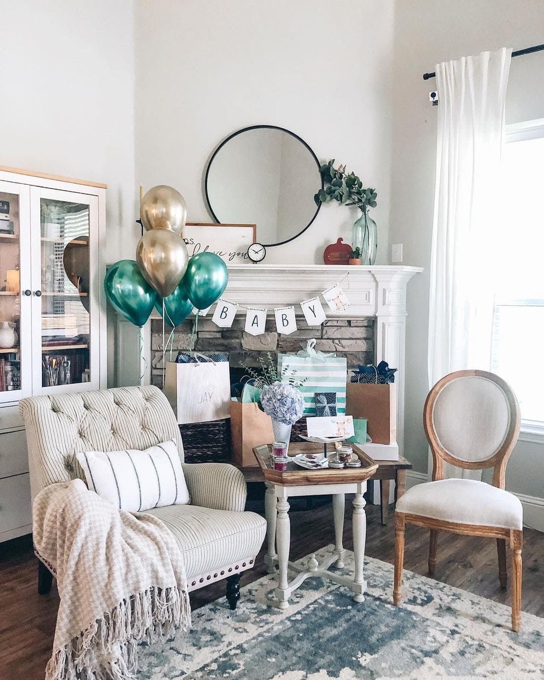 virtual baby shower setup with decorations and gifts