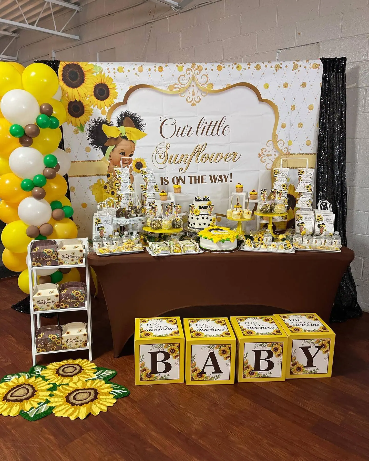 a picture of a sunflower baby shower organized by Tantastic Events