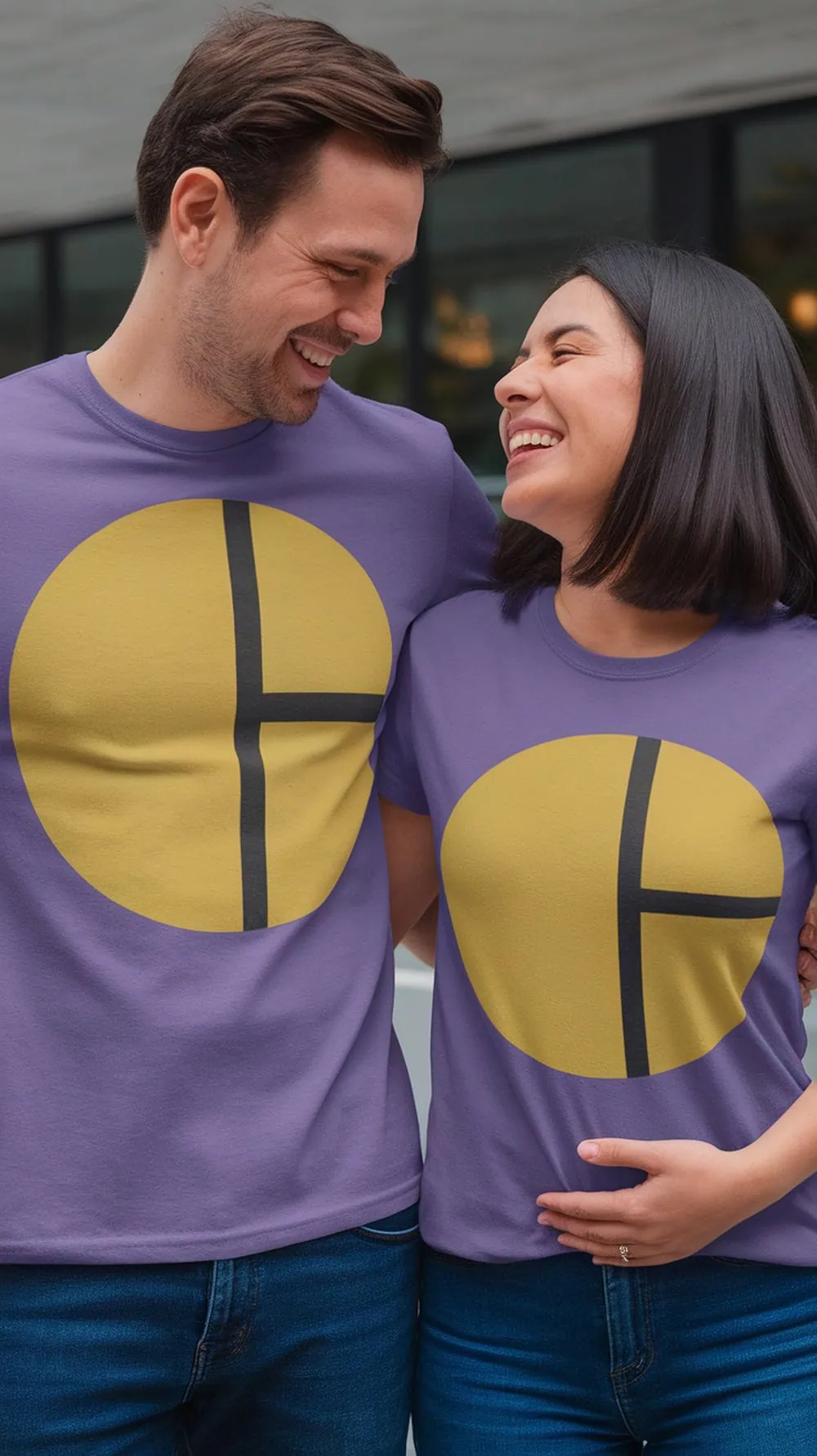 Couple wearing matching purple T-shirts with a playful design, smiling and celebrating their gender reveal.