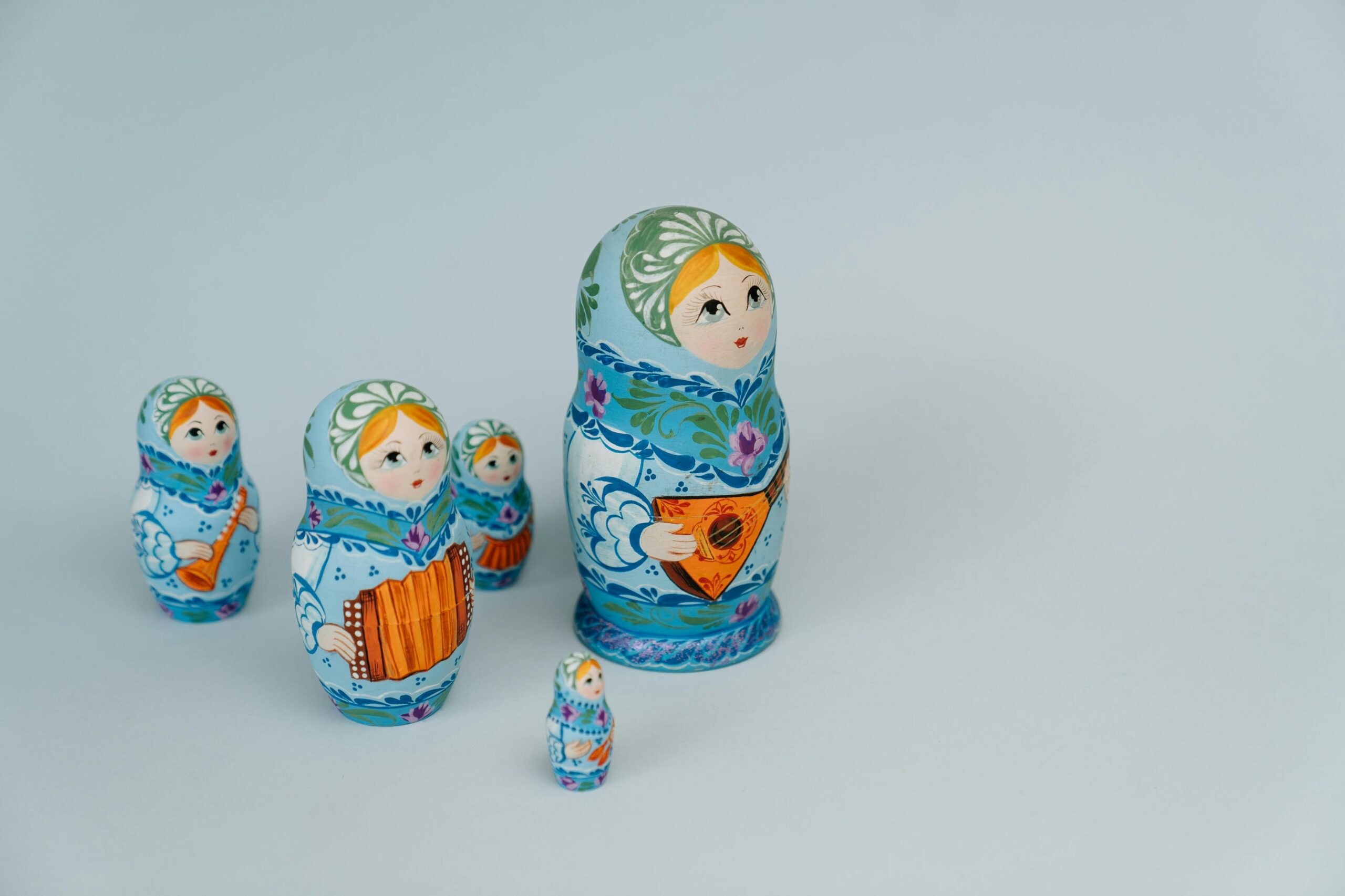 Vibrant Russian Matryoshka dolls in traditional attire, symbolizing family and culture.