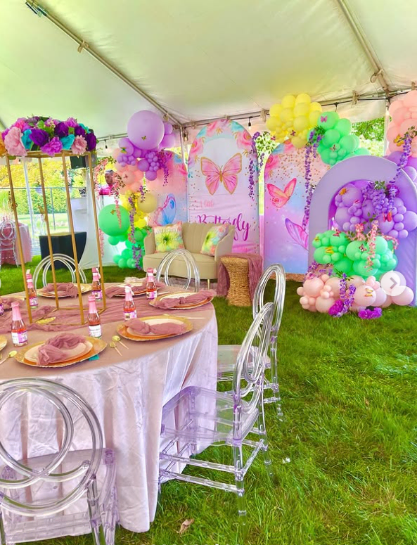 Colorful balloon and flower decorations for a baby shower celebration.