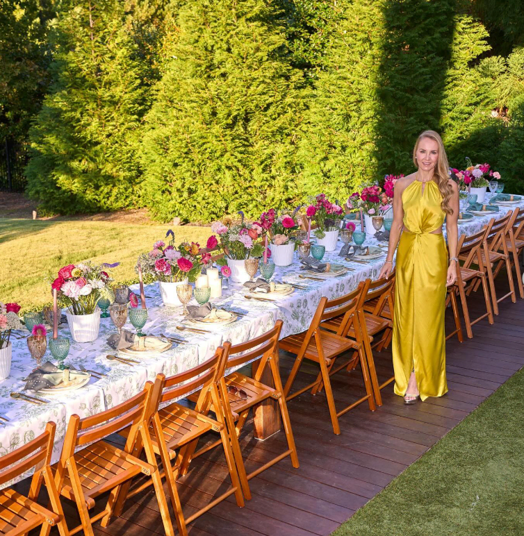 Elegant outdoor garden party setup with floral table decor for baby shower.