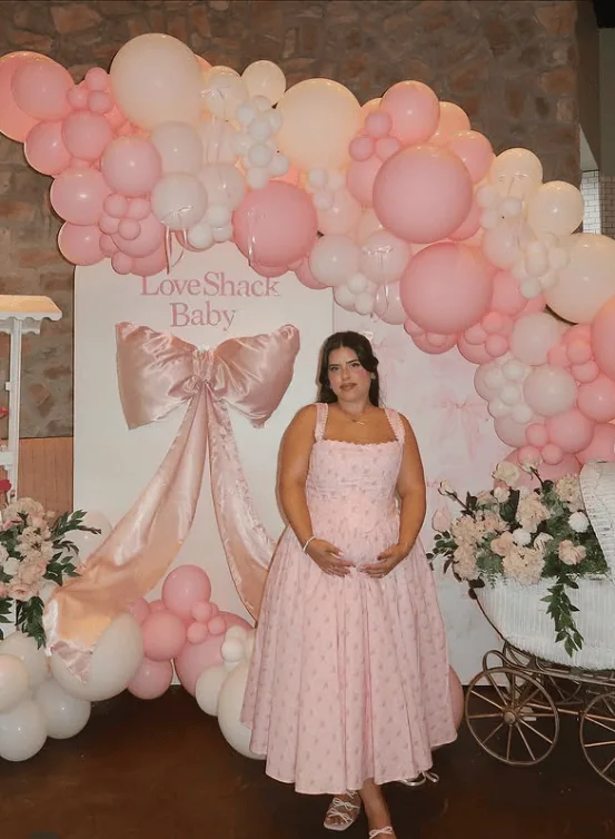 Beautiful pink balloon arrangement for a baby shower celebration.